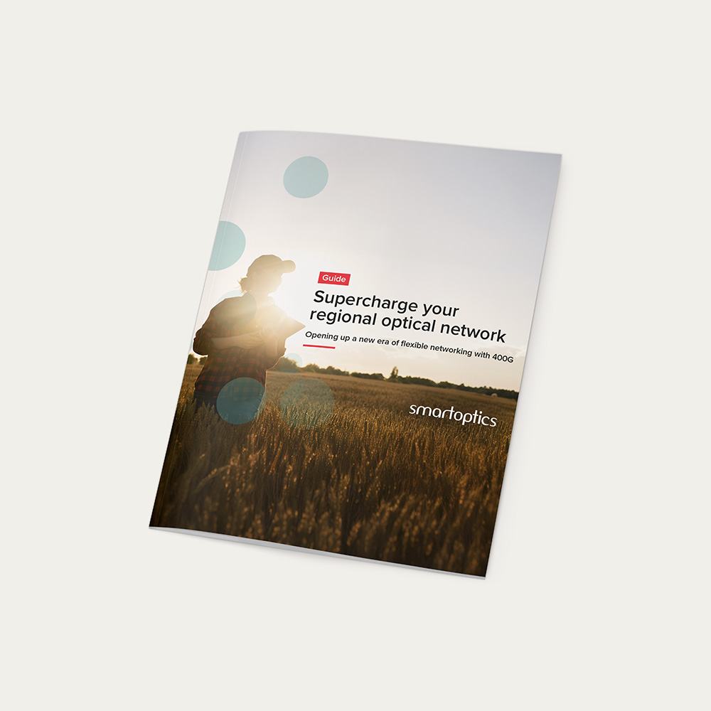 A booklet titled "Supercharge your regional optical network" by Smartoptics with a person in a field on the cover.
