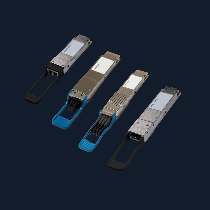 Four different computer network transceivers with blue and black pull-tabs on a dark background.