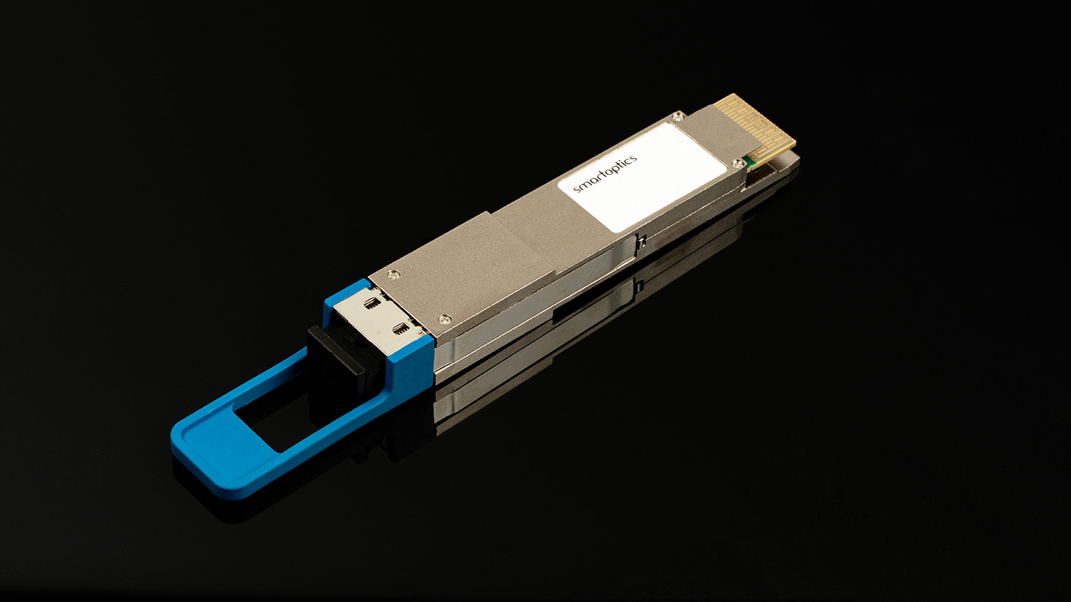 A silver transceiver module with a blue pull tab, labelled "smartoptics", on a black background.